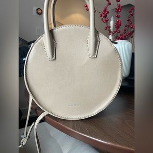 Mat and Nat cream round cross body purse